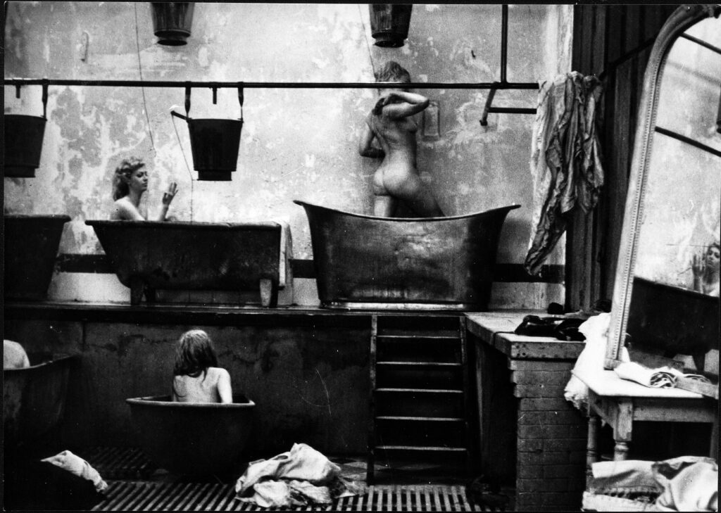 Women bathing in tin tubs in the black and white bathhouse scene of Goto, l&rsquo;ile d&rsquo;Amour (1968)