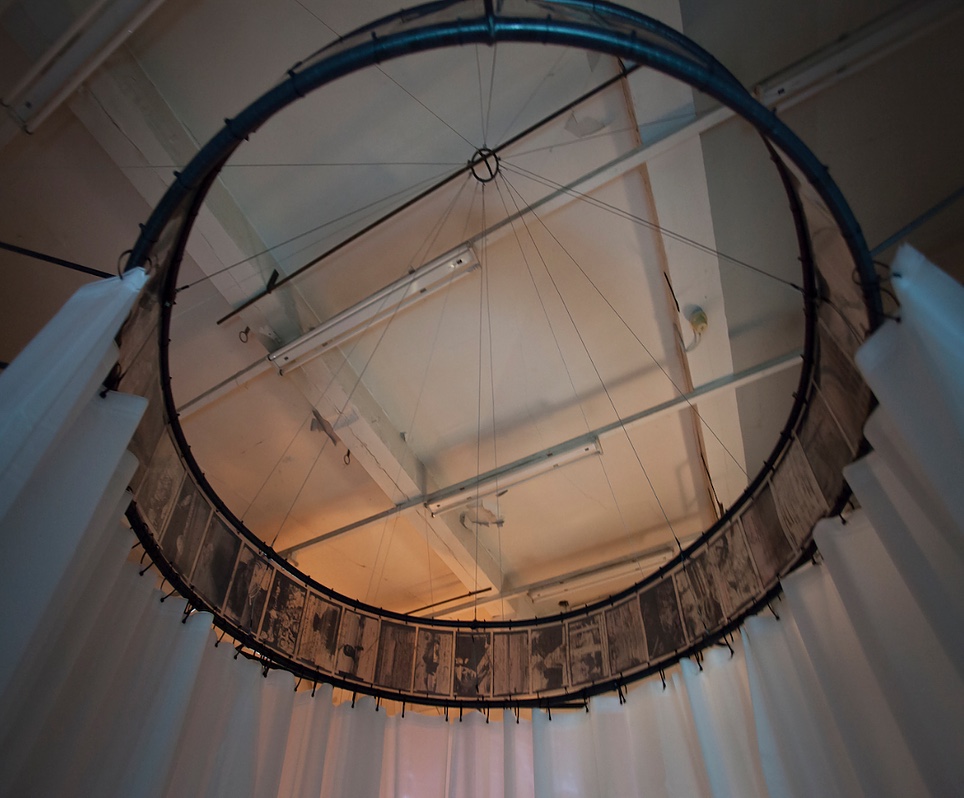 One of the film-reel curtain rings of Spoor by Natasha Bourke, seen from below